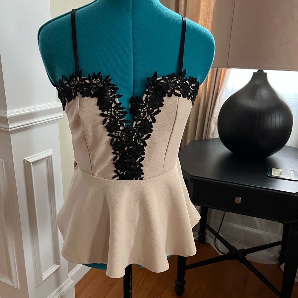 Elegant Cream Peplum Top with Black Lace